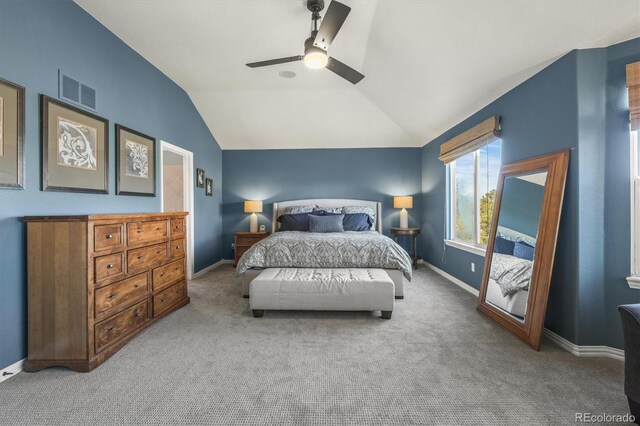 bedroom with a ceiling fan, visible vents, lofted ceiling, and carpet