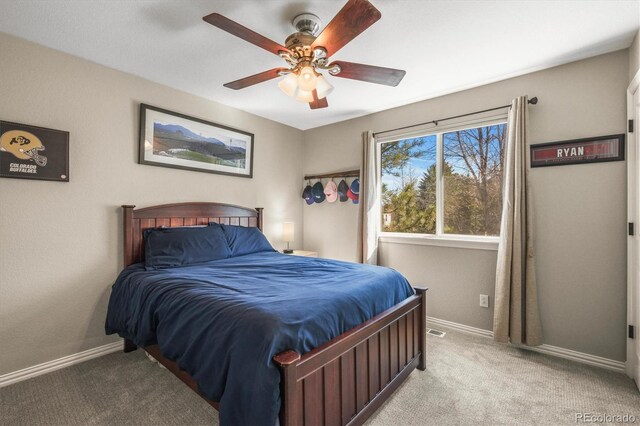 bedroom with baseboards, ceiling fan, light carpet, and visible vents