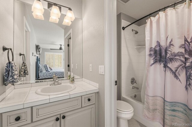 ensuite bathroom with connected bathroom, toilet, shower / bathtub combination with curtain, and vanity