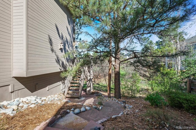 view of yard featuring stairway