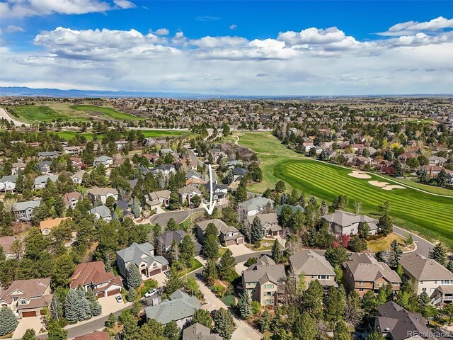 drone / aerial view featuring a residential view and golf course view