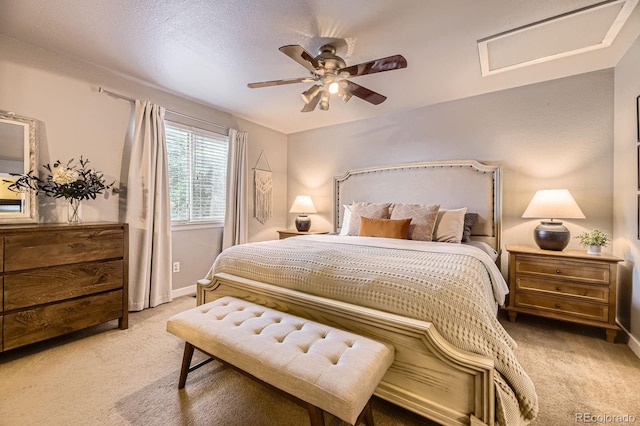 12476 W Prentice Pl, Littleton, CO 80127 - bedroom with light carpet, ceiling fan, and attic access