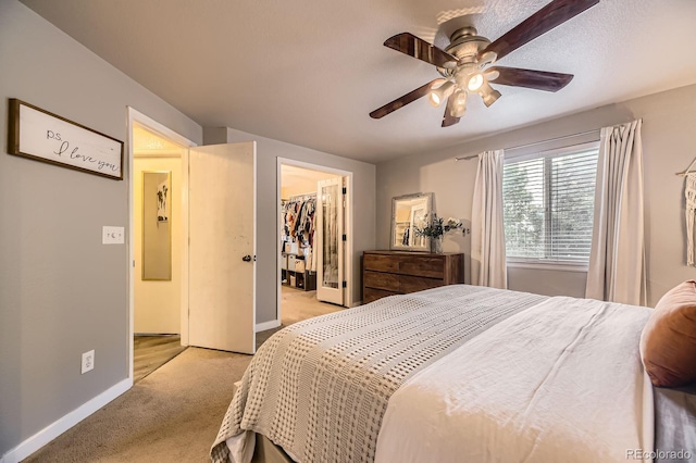 12476 W Prentice Pl, Littleton, CO 80127 - bedroom with light colored carpet, a spacious closet, a ceiling fan, and a closet