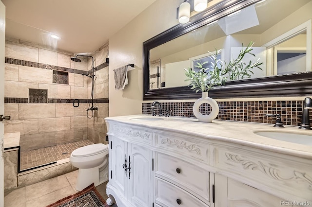 12476 W Prentice Pl, Littleton, CO 80127 - full bath with a tile shower, double vanity, tasteful backsplash, and tile patterned flooring
