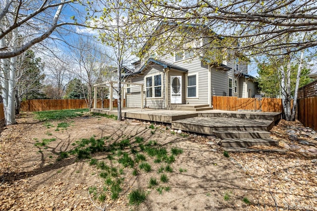 16434 Homestead Ct, Parker, CO 80134 - back of house featuring a fenced backyard and a deck
