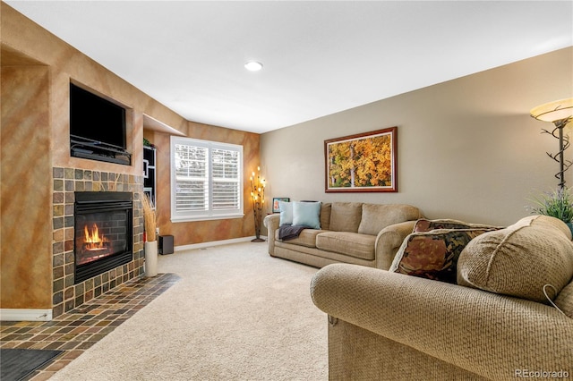 living room with recessed lighting, a fireplace, baseboards, and carpet