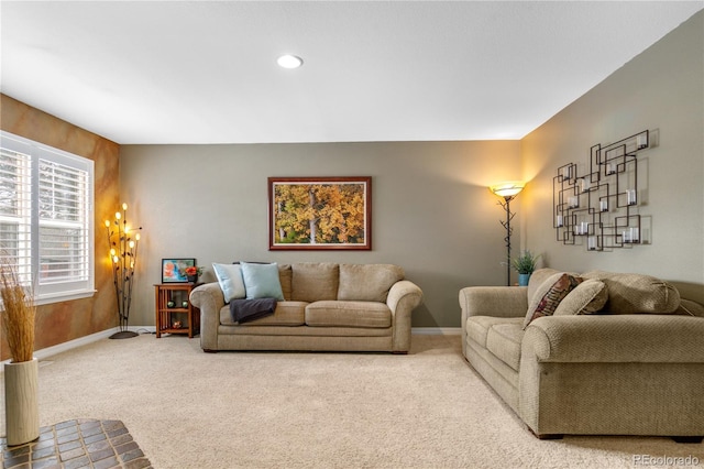 carpeted living area featuring recessed lighting and baseboards