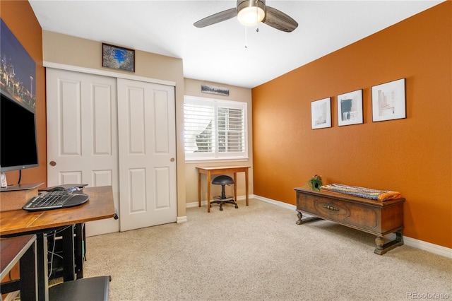 office space featuring carpet flooring, ceiling fan, and baseboards