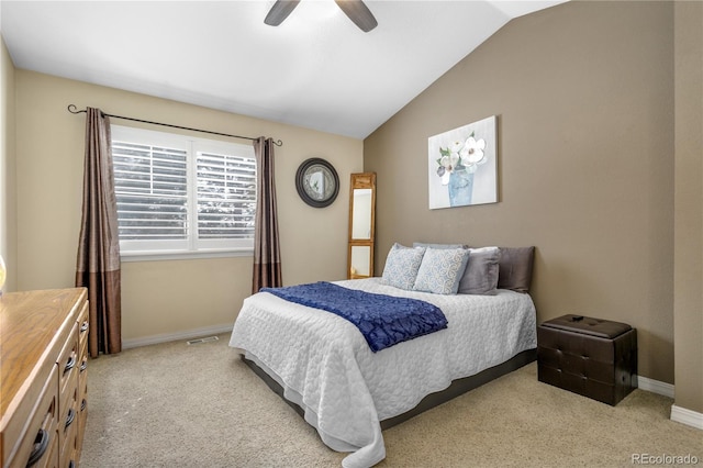 bedroom with vaulted ceiling, a ceiling fan, baseboards, and light carpet