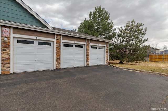 garage with fence