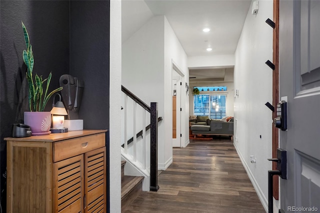 entrance foyer with stairway, dark wood-style flooring, recessed lighting, and baseboards