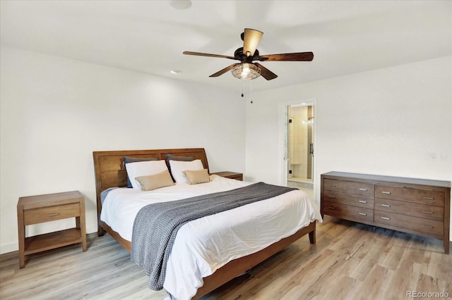 11575 Wilson Cir, Parker, CO 80134 - bedroom featuring light wood finished floors, ceiling fan, and ensuite bathroom