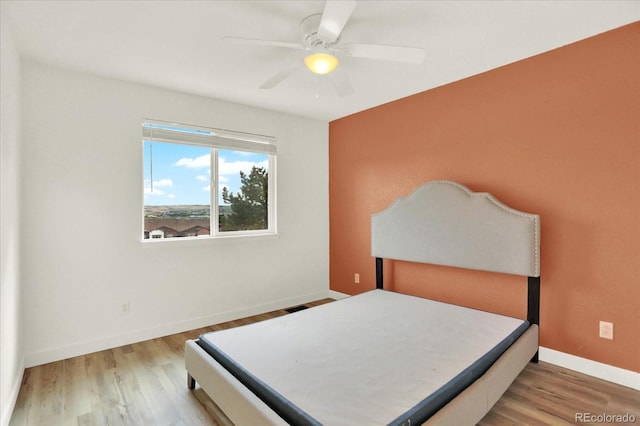 11575 Wilson Cir, Parker, CO 80134 - bedroom with wood finished floors and a ceiling fan