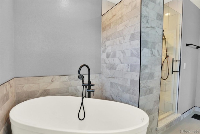 11575 Wilson Cir, Parker, CO 80134 - bathroom with walk in shower and a freestanding tub