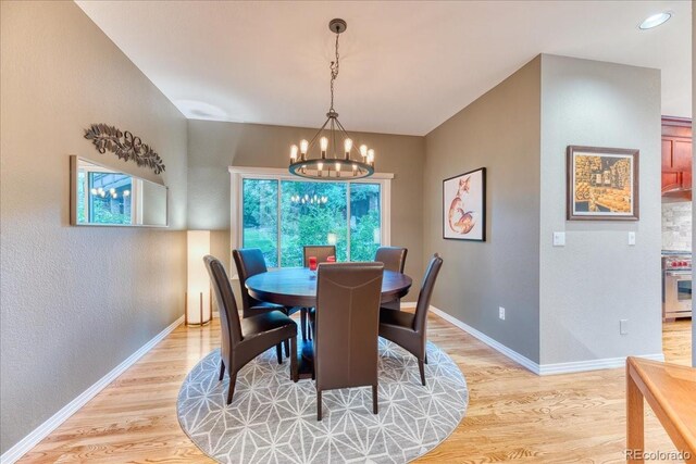 16642 W Archer Ave, Golden, CO 80401 - dining area with a chandelier, light wood finished floors, and a textured wall