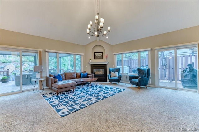 16642 W Archer Ave, Golden, CO 80401 - living room featuring carpet, a chandelier, vaulted ceiling, and a glass covered fireplace