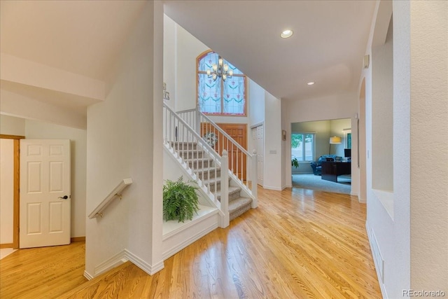 16642 W Archer Ave, Golden, CO 80401 - stairway featuring wood finished floors, a chandelier, and recessed lighting