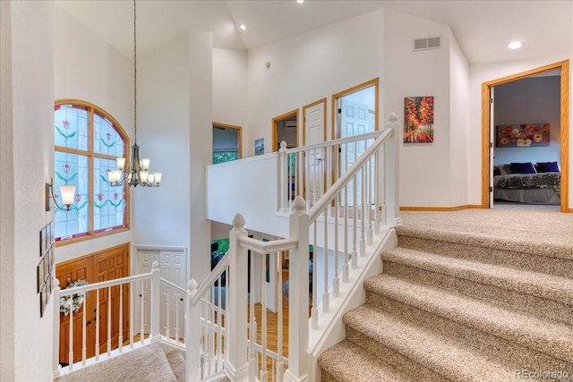 16642 W Archer Ave, Golden, CO 80401 - staircase with carpet, a chandelier, and a high ceiling
