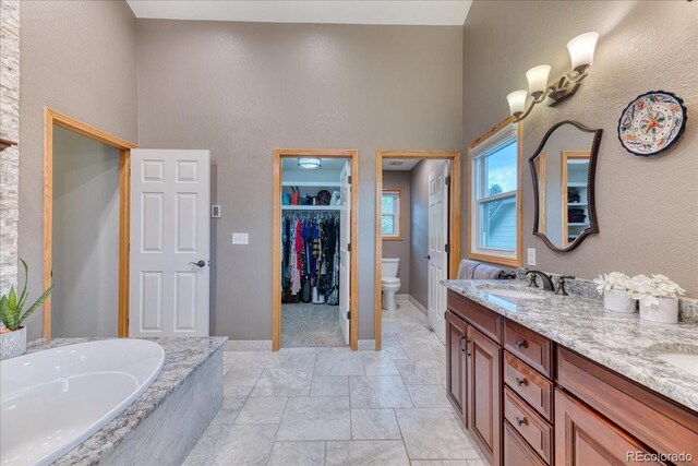 16642 W Archer Ave, Golden, CO 80401 - full bath with a high ceiling, double vanity, a garden tub, and a walk in closet