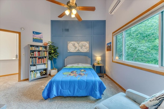 16642 W Archer Ave, Golden, CO 80401 - carpeted bedroom with an AC wall unit, a ceiling fan, and a high ceiling