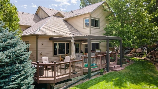 16642 W Archer Ave, Golden, CO 80401 - rear view of property with a lawn and a wooden deck