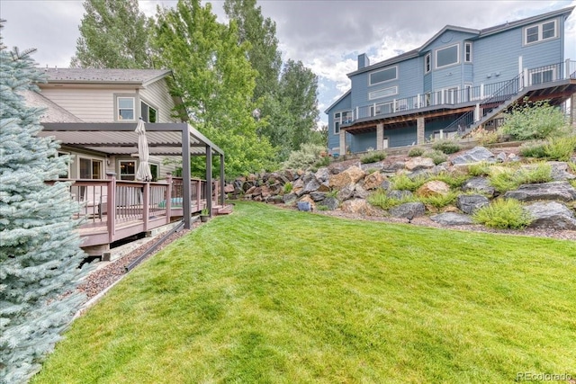 16642 W Archer Ave, Golden, CO 80401 - view of green lawn with a deck and an attached garage