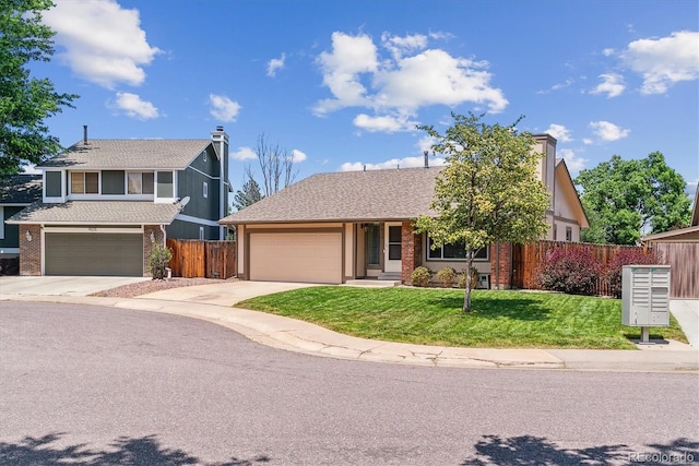 9015 W Tanforan Dr, Littleton, CO 80123 - view of front of house with concrete driveway and brick siding