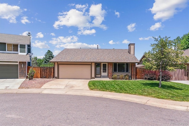 9015 W Tanforan Dr, Littleton, CO 80123 - view of front facade with concrete driveway, brick siding, a garage, and a chimney