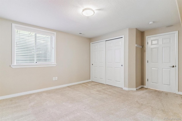 9015 W Tanforan Dr, Littleton, CO 80123 - unfurnished bedroom featuring carpet, a closet, and a textured ceiling