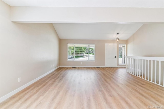 9015 W Tanforan Dr, Littleton, CO 80123 - spare room featuring lofted ceiling and light wood-style flooring