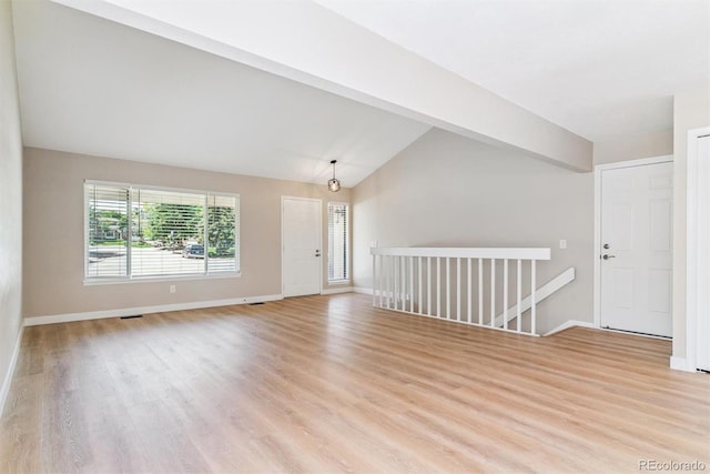 9015 W Tanforan Dr, Littleton, CO 80123 - unfurnished room featuring lofted ceiling and light wood-type flooring