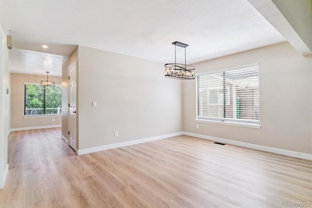 9015 W Tanforan Dr, Littleton, CO 80123 - unfurnished room with a chandelier, light wood finished floors, and recessed lighting