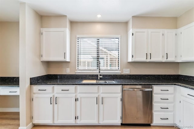 9015 W Tanforan Dr, Littleton, CO 80123 - kitchen with stainless steel dishwasher, white cabinetry, dark stone counters, and recessed lighting