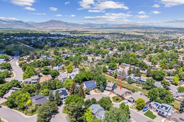 9015 W Tanforan Dr, Littleton, CO 80123 - aerial view of residential area with a mountainous background