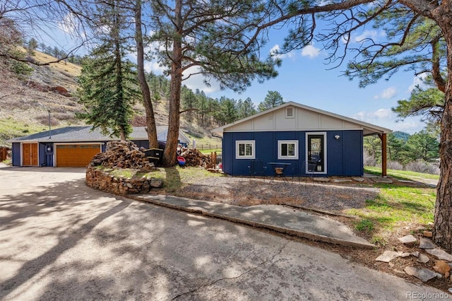 5384 Olde Stage Rd, Boulder, CO 80302 - exterior space featuring an outdoor structure, board and batten siding, and driveway