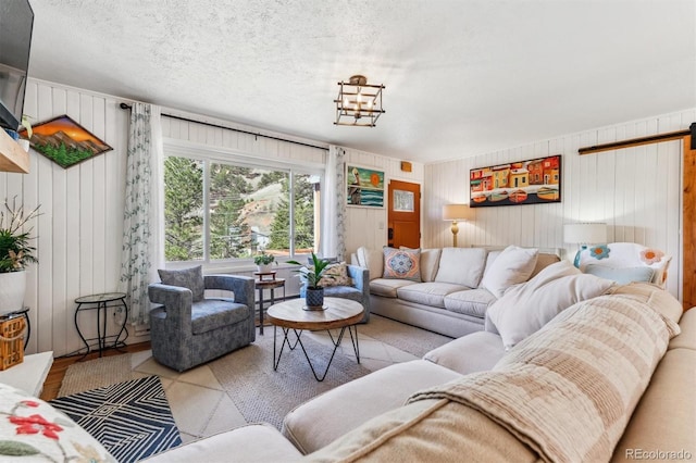 5384 Olde Stage Rd, Boulder, CO 80302 - living area featuring wooden walls, a barn door, and wood finished floors