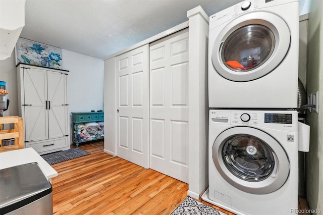 5384 Olde Stage Rd, Boulder, CO 80302 - laundry area featuring light wood-style floors, stacked washer / drying machine, and laundry area