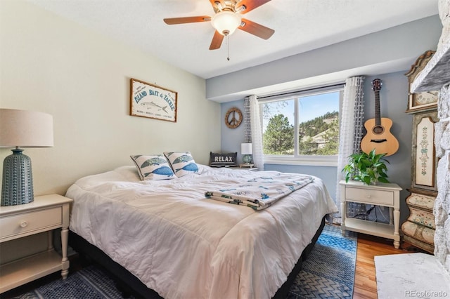 5384 Olde Stage Rd, Boulder, CO 80302 - bedroom with a ceiling fan and wood finished floors