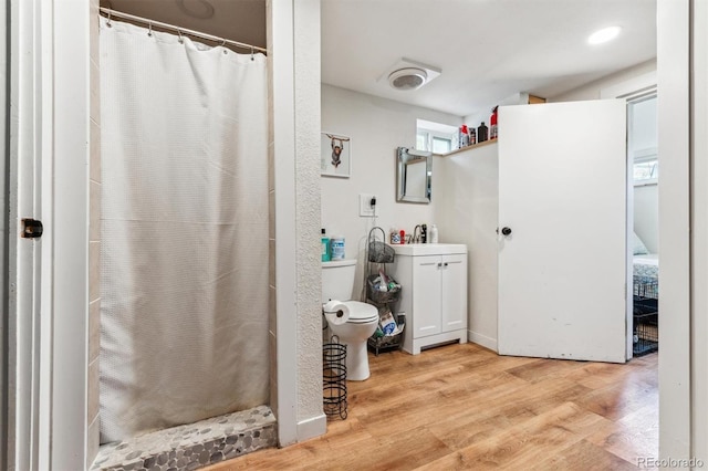 5384 Olde Stage Rd, Boulder, CO 80302 - full bath featuring vanity, wood finished floors, toilet, and a shower with curtain