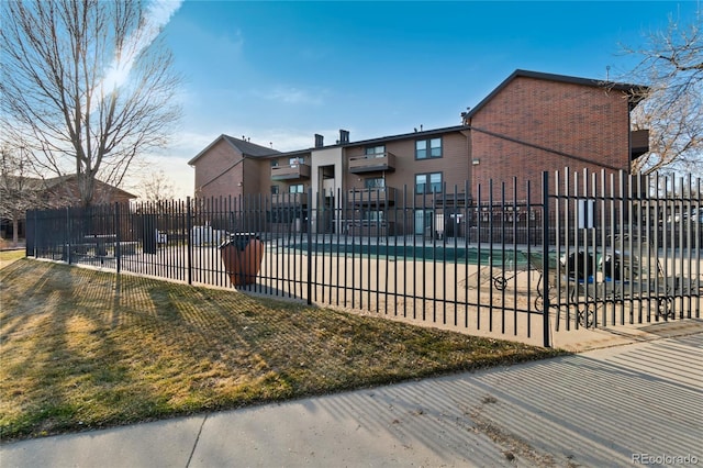 view of pool featuring fence