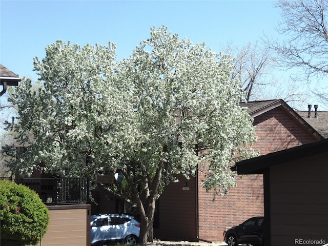 view of side of property with brick siding