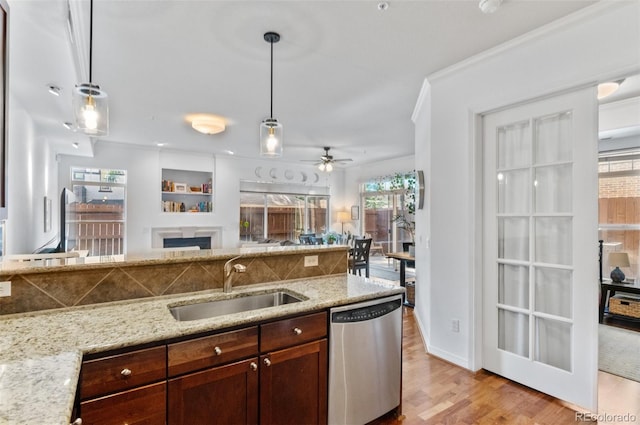 1776 Race St Unit 109, Denver, CO 80206 - kitchen with dishwasher, light wood-type flooring, hanging light fixtures, open floor plan, and crown molding
