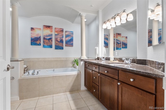 1776 Race St Unit 109, Denver, CO 80206 - bathroom featuring ornate columns, double vanity, a bath, and tile patterned flooring