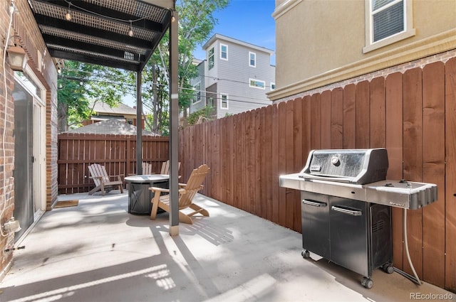 1776 Race St Unit 109, Denver, CO 80206 - view of patio with area for grilling and an outdoor fire pit