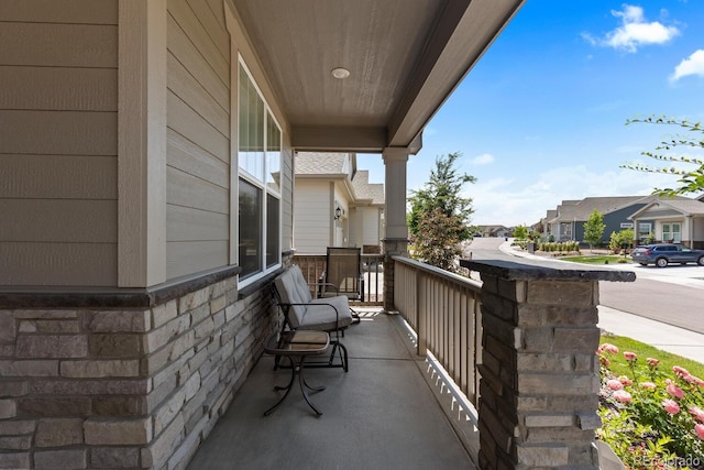 15802 Xanthia Way, Thornton, CO 80602 - covered porch featuring a residential view