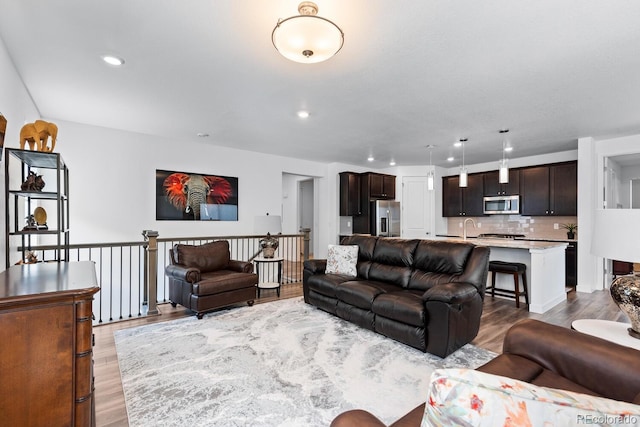 15802 Xanthia Way, Thornton, CO 80602 - living room with light wood-style flooring and recessed lighting