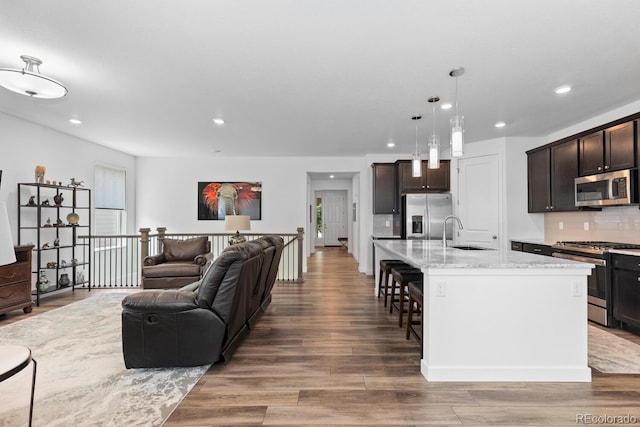 15802 Xanthia Way, Thornton, CO 80602 - living area featuring recessed lighting and wood finished floors