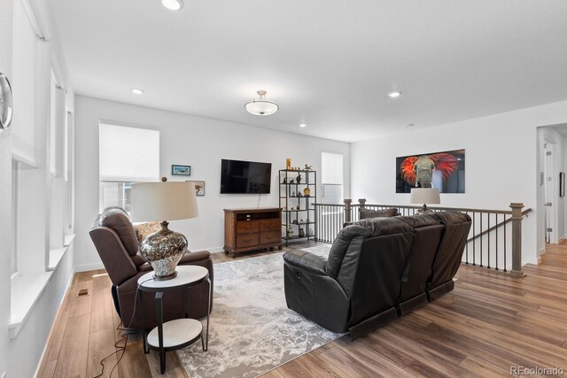 15802 Xanthia Way, Thornton, CO 80602 - living area featuring wood finished floors and recessed lighting