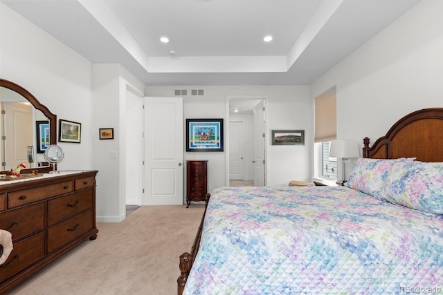 15802 Xanthia Way, Thornton, CO 80602 - bedroom with light carpet, a tray ceiling, and recessed lighting