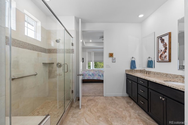 15802 Xanthia Way, Thornton, CO 80602 - full bath featuring double vanity, a stall shower, ensuite bathroom, recessed lighting, and marble finish floors
